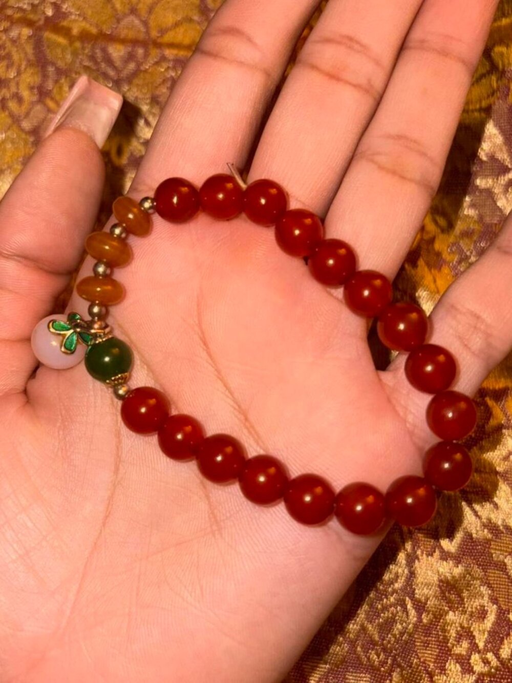 Red and orange beaded jade bracelet